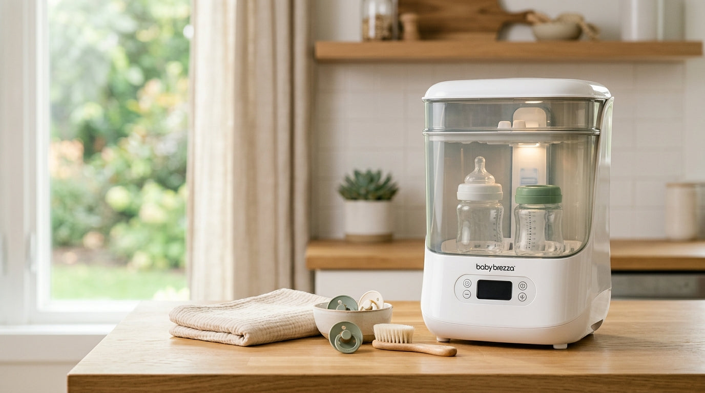 Baby Brezza sterilizer on a kitchen counter next to silicone baby bottles