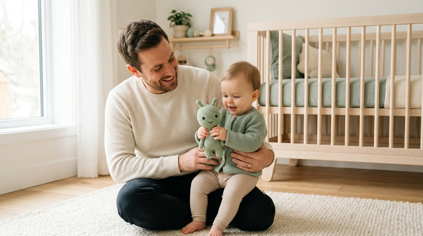 A tired dad holding his 11 month old baby while wearing a star wars shirt