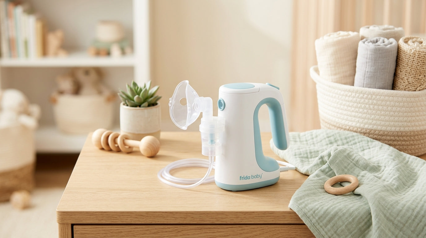 A tired dad holding a baby using a whisper-quiet Frida Baby nebulizer