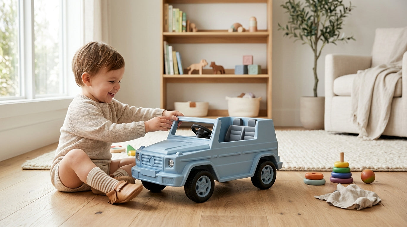 A stressed mom holding a coffee mug while watching a toddler in a toy car