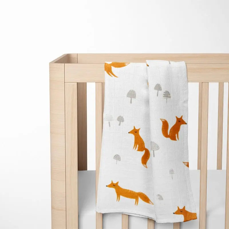 Personalized fox bamboo baby blanket with custom name embroidery in soft neutral tones
