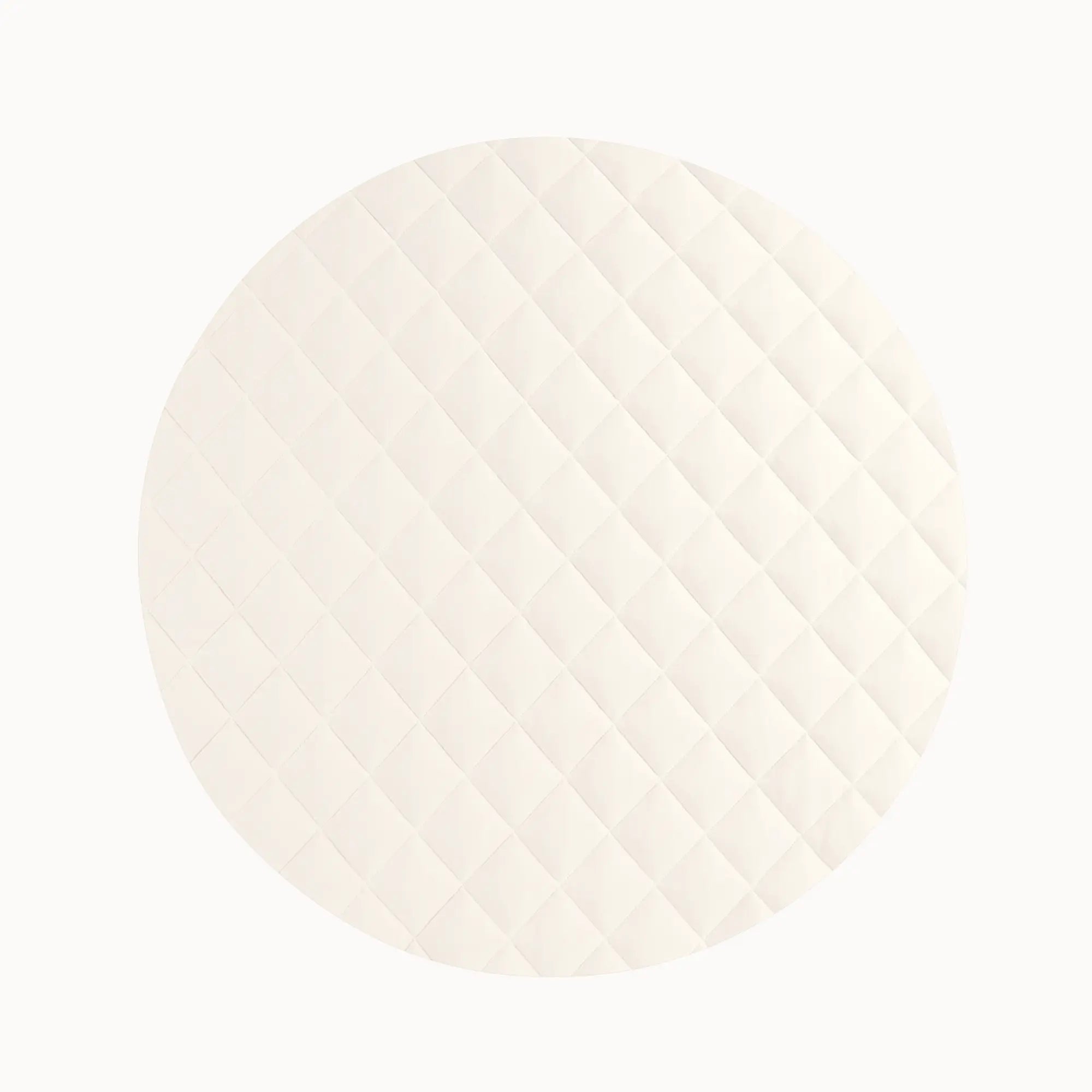 Close-up of cream-colored quilted vegan playmat showing soft texture for baby's comfort during play