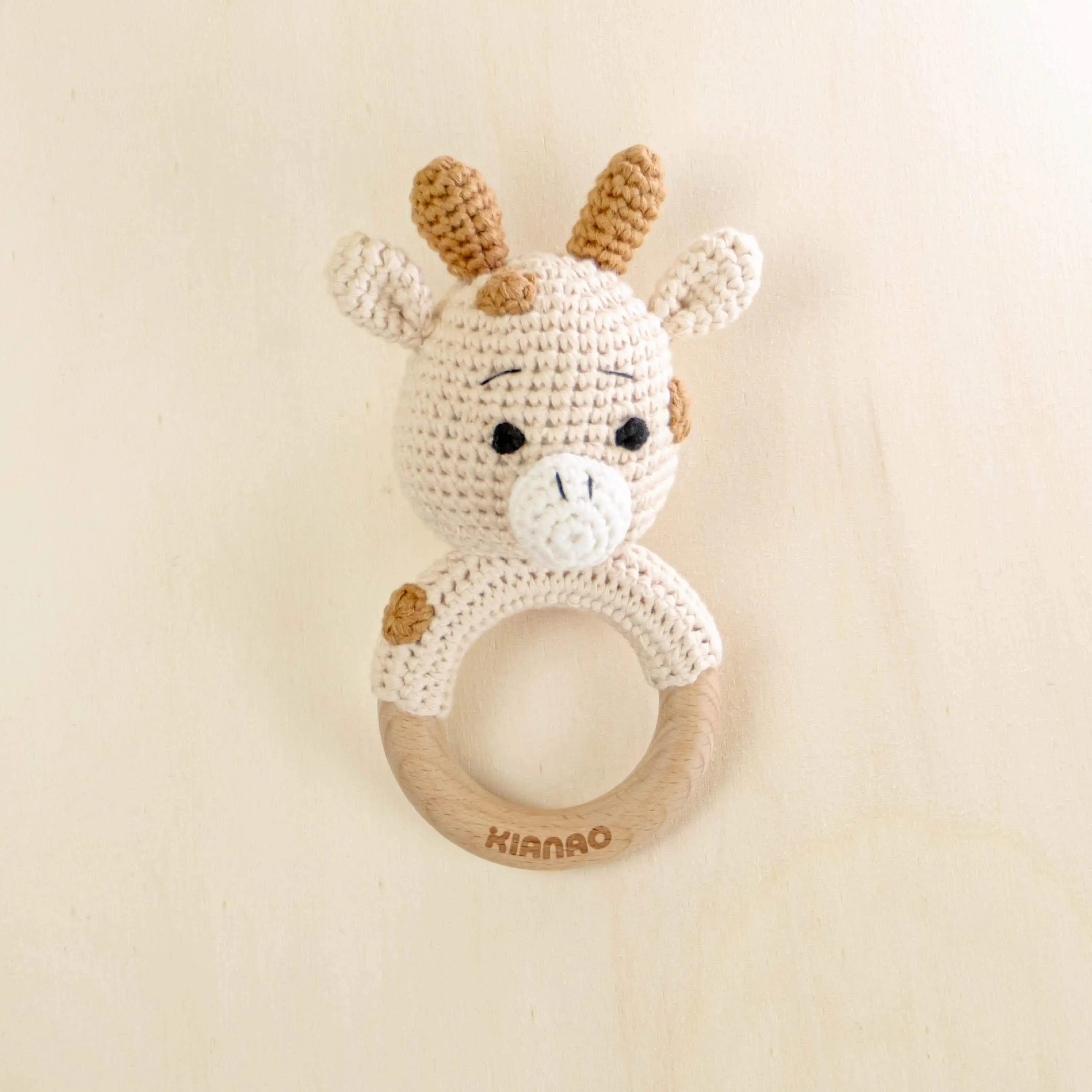 beige and white crochet deer rattle teething toy with wooden ring for babies, organic cotton handmade baby teether