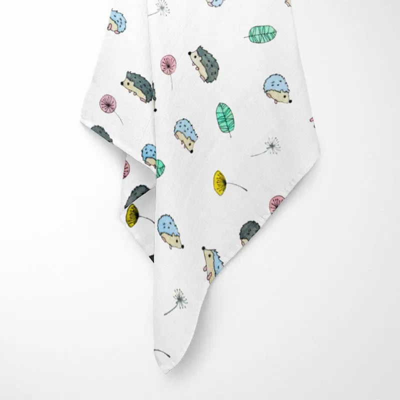 fully opened colorful hedgehog bamboo baby blanket displaying woodland pattern with cute hedgehogs in various colors on breathable organic fabric