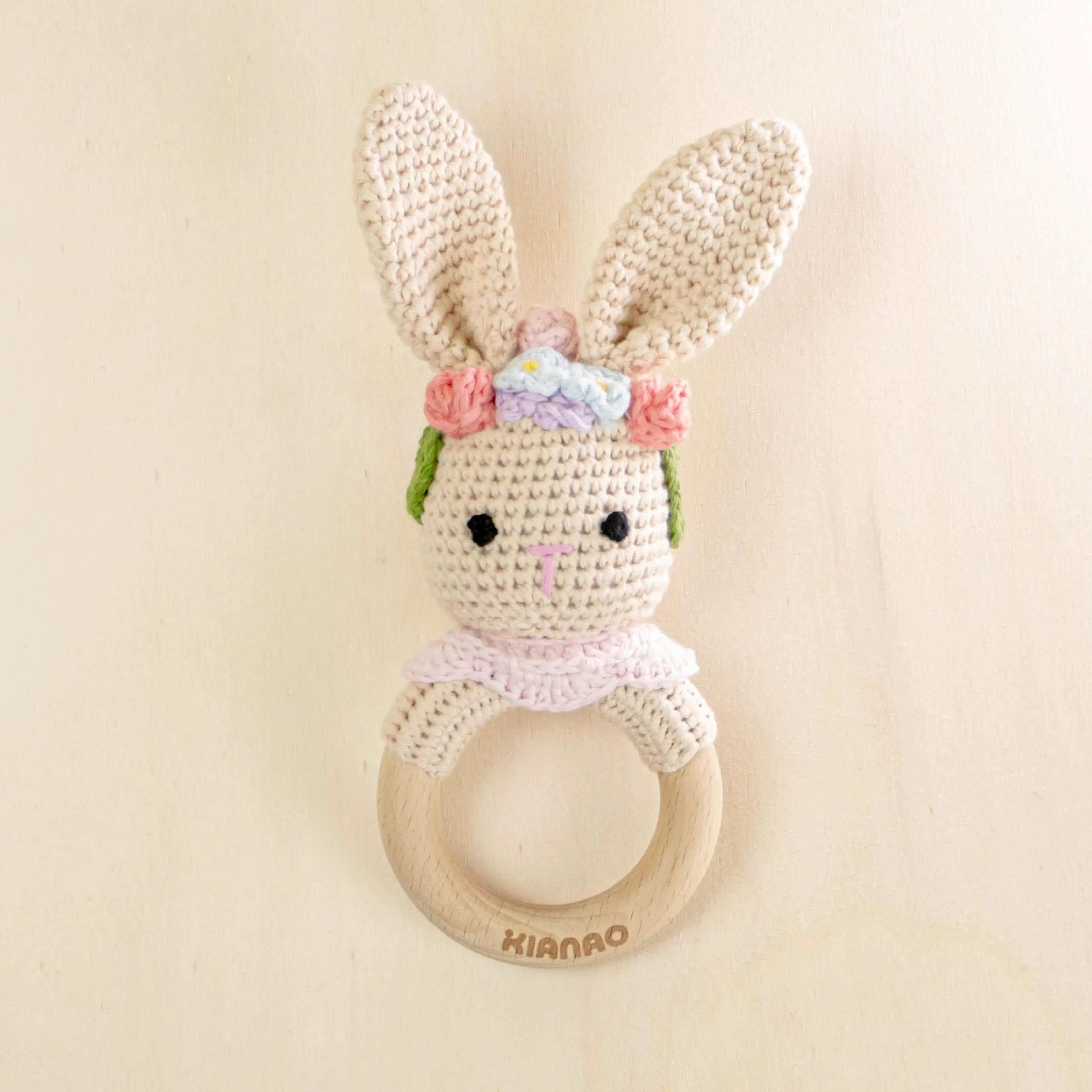 cream crochet bunny rattle teething toy with wooden ring, organic cotton baby teether with long ears and floral crown detail