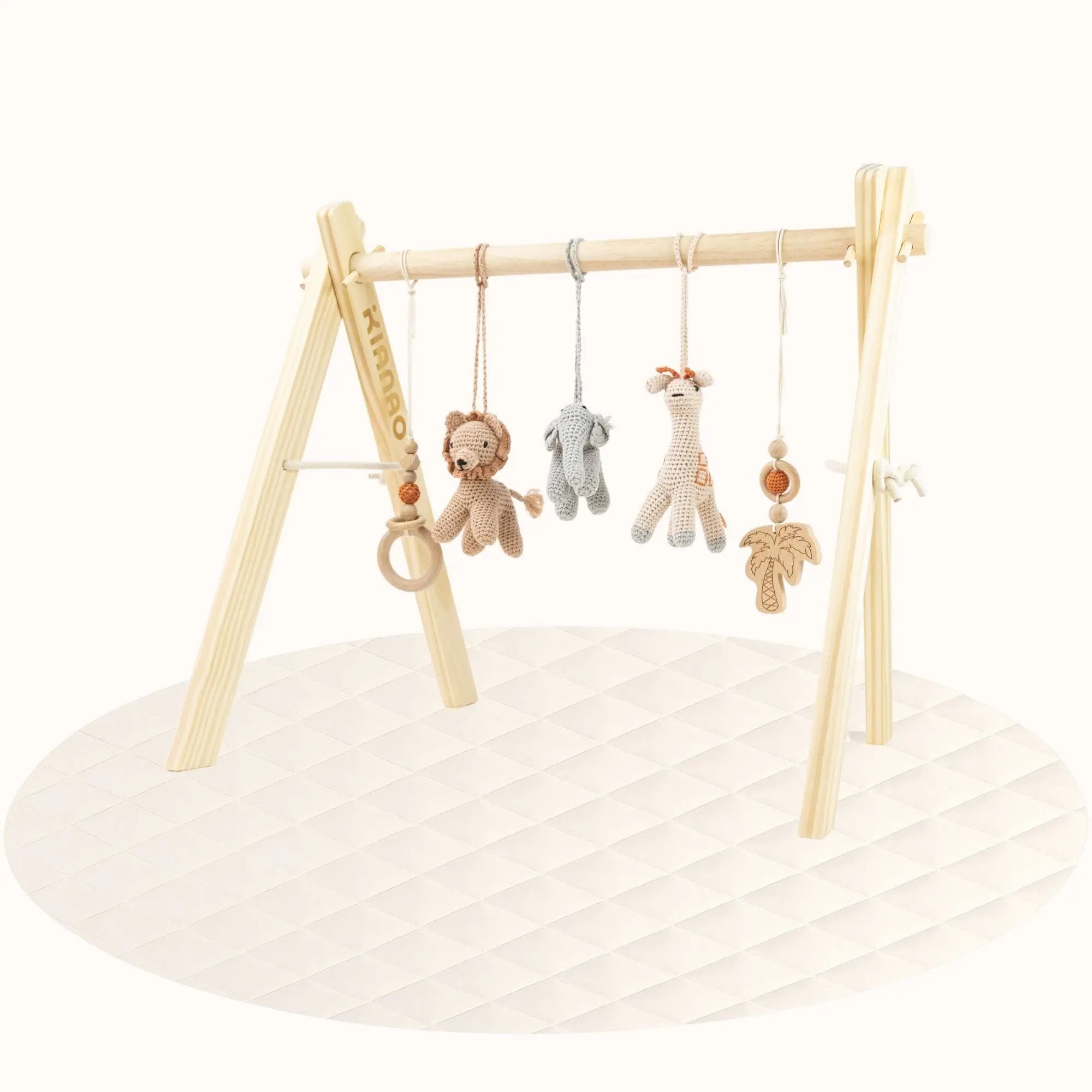 wooden baby play gym setup on cream round play mat creating complete activity space