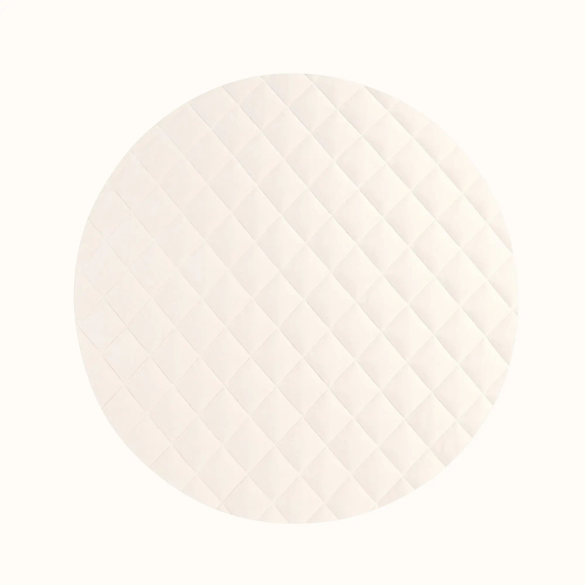 Close-up of cream-colored vegan playmat texture showing quilted surface perfect for tummy time comfort
