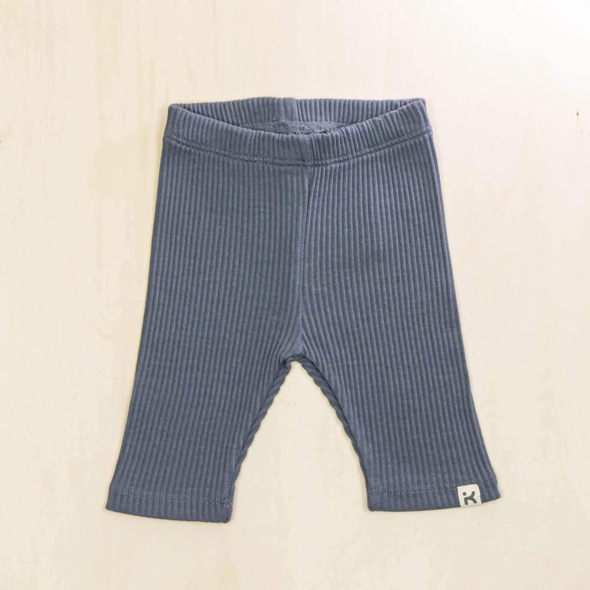 indigo blue baby leggings made from soft ribbed organic cotton, stretchy and breathable baby pants