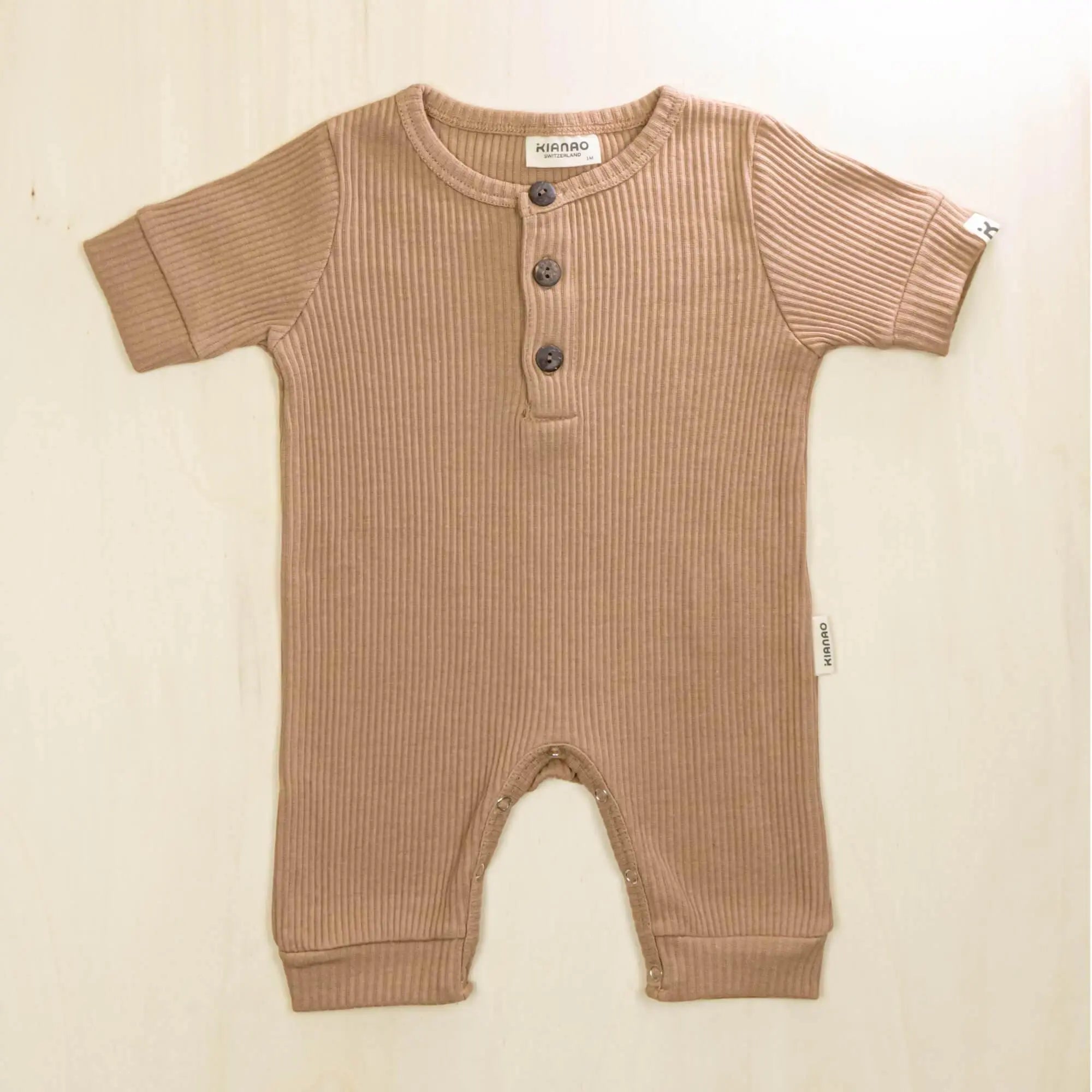 mocha organic cotton baby romper with three-button henley neckline and short sleeves for easy dressing