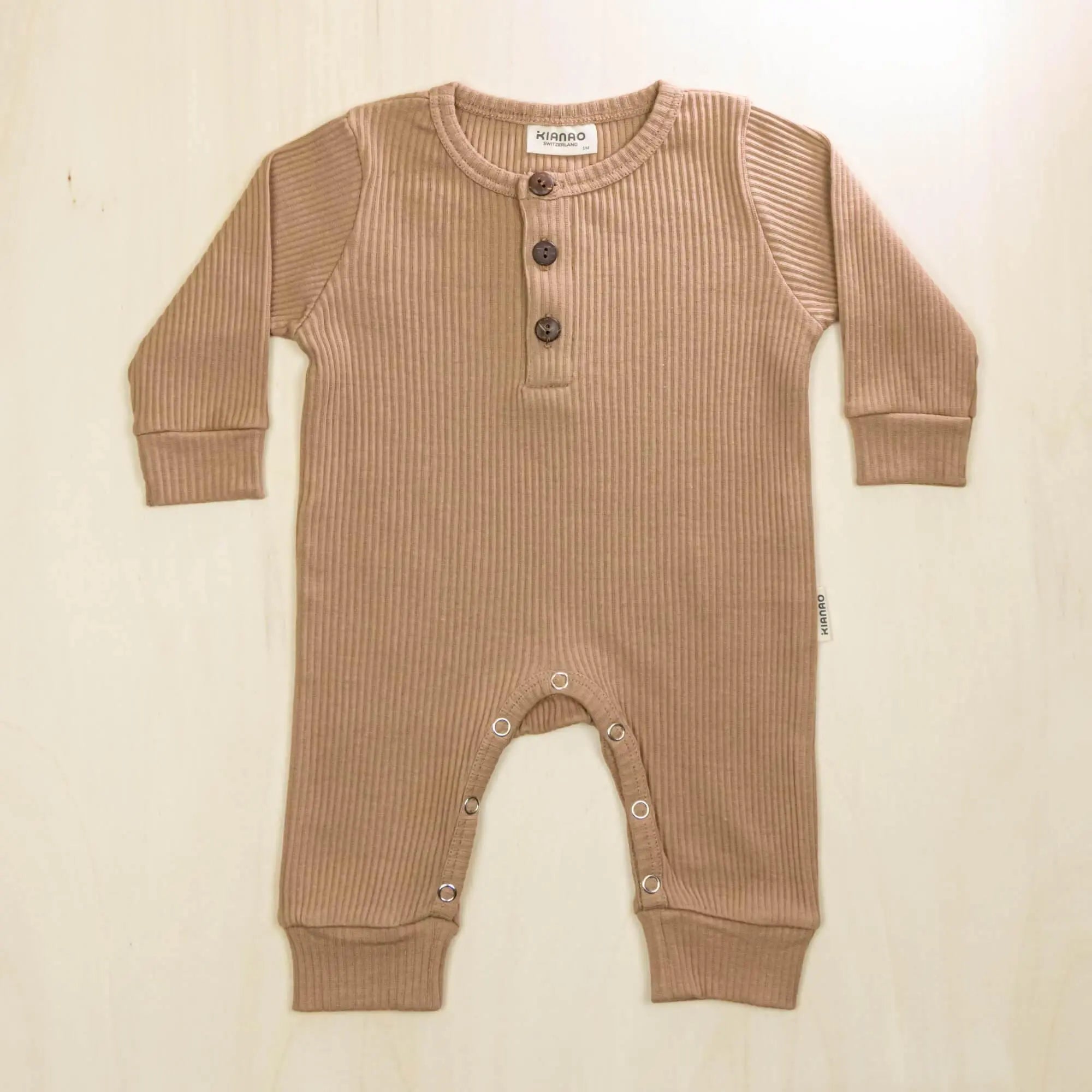 mocha organic cotton baby romper with cozy long sleeves and henley button placket for easy dressing