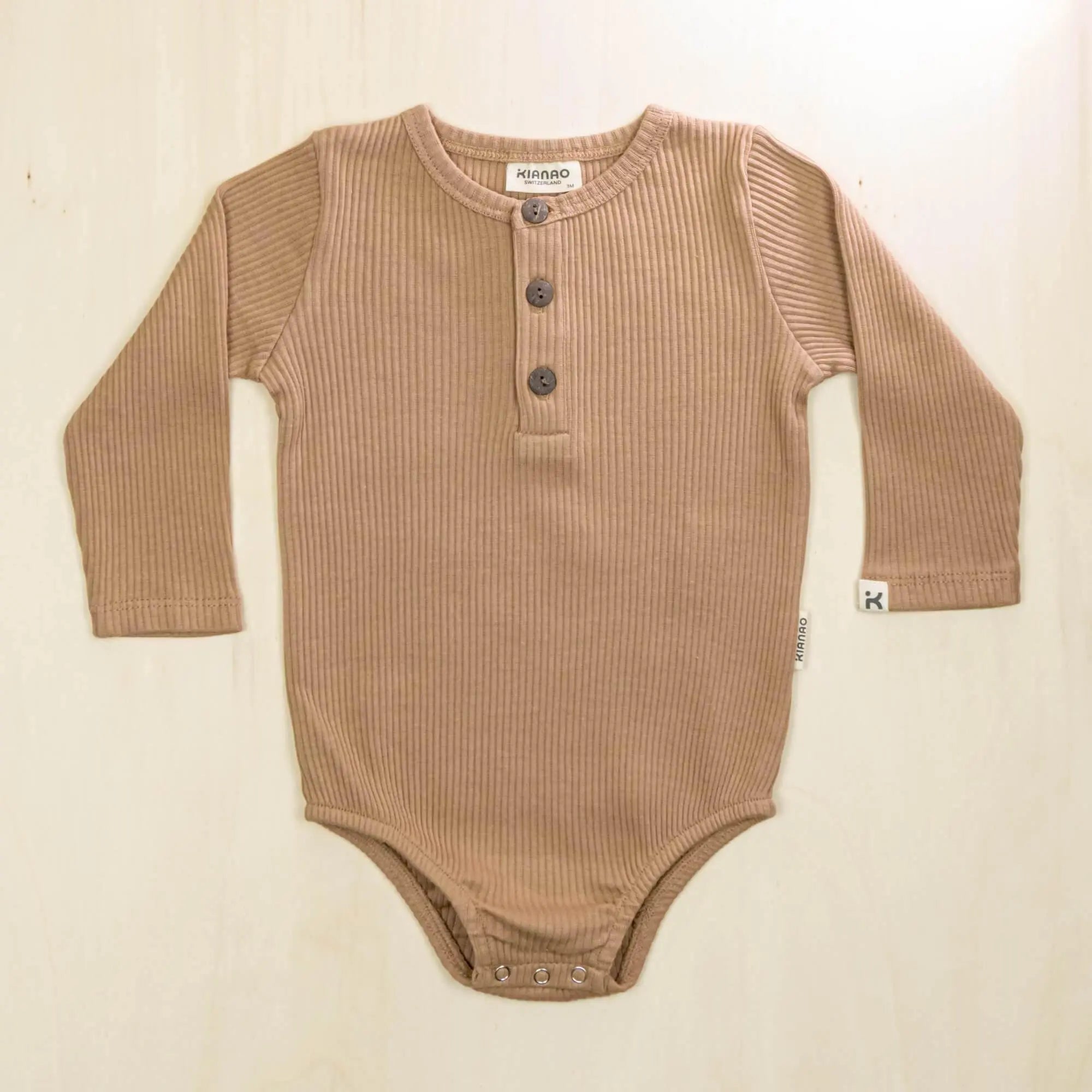 mocha organic cotton long sleeve bodysuit with three-button henley neckline for easy dressing in cool weather