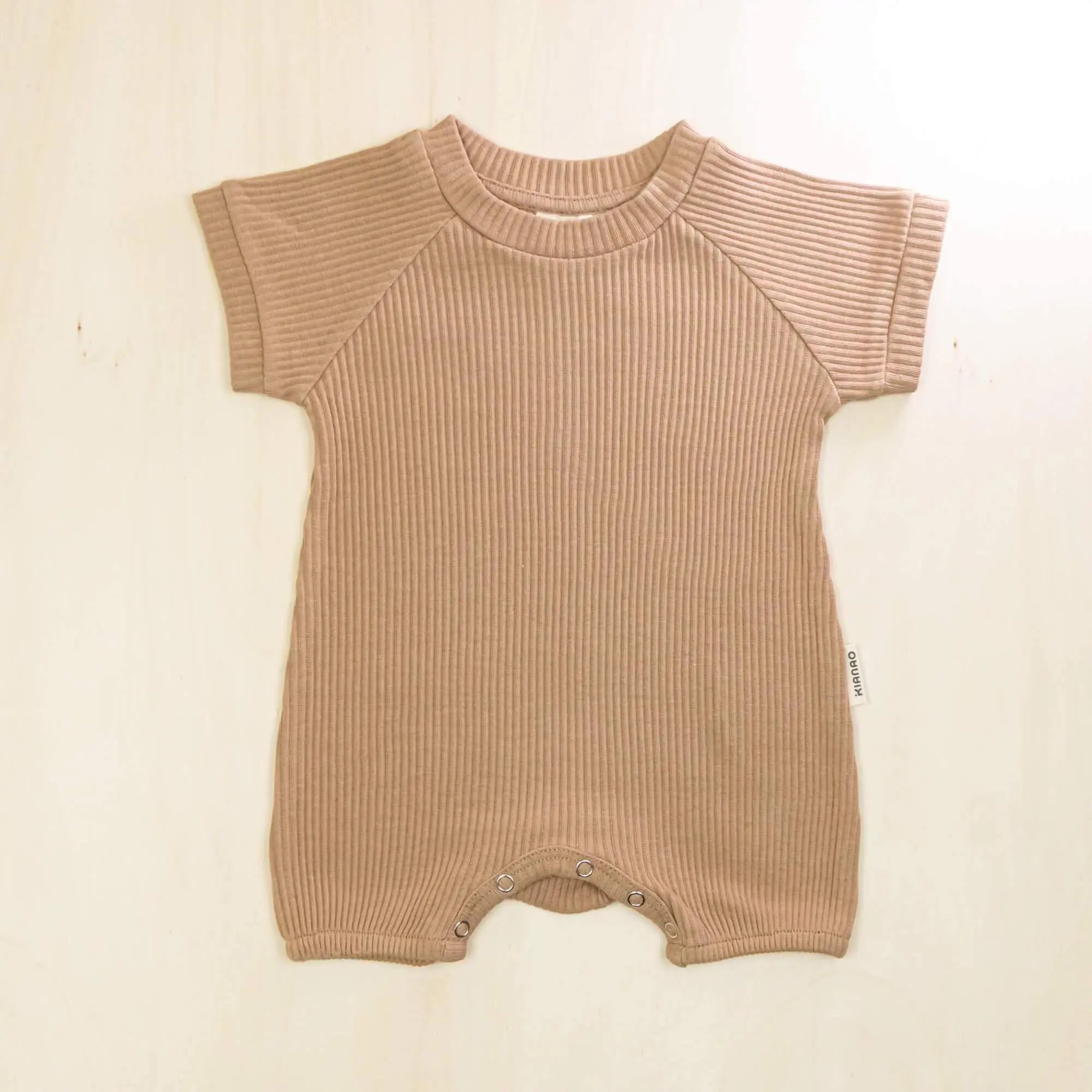 mocha organic cotton baby romper with short sleeves and gentle elastic leg openings
