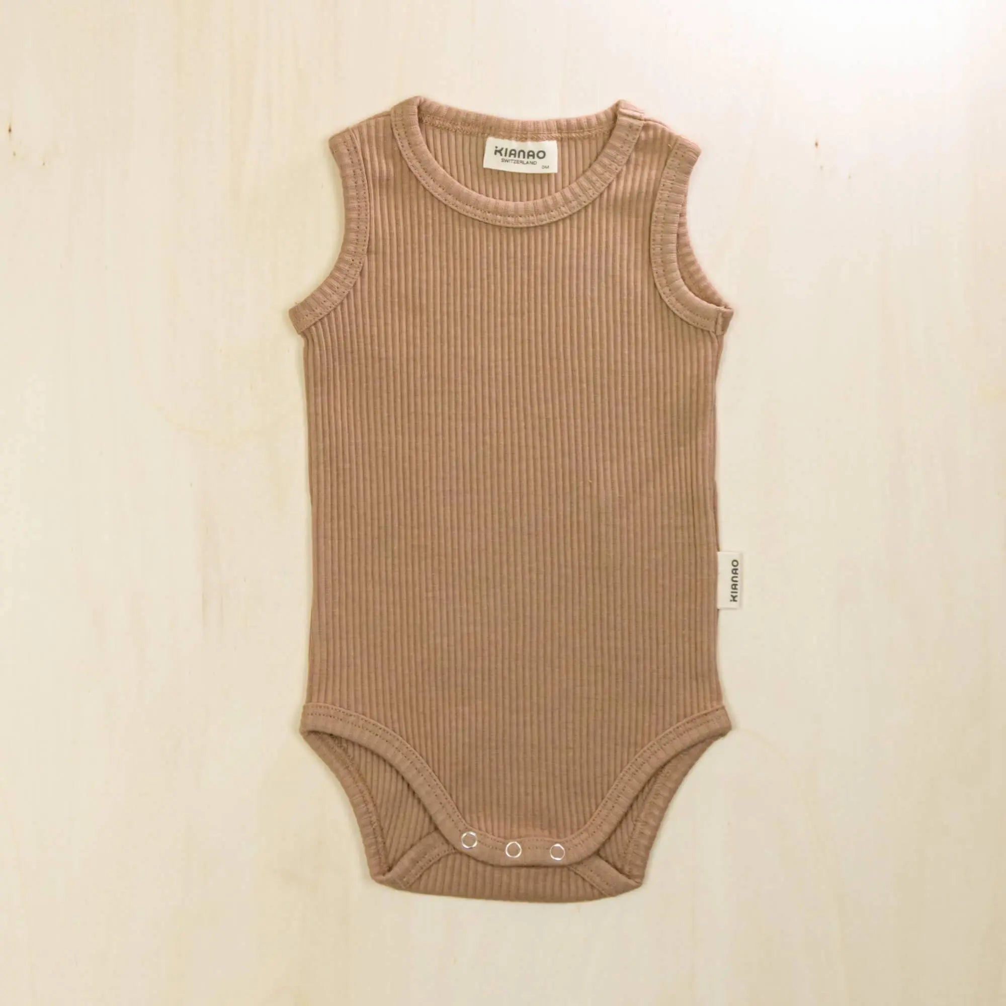 mocha organic cotton baby bodysuit made with 95% organic cotton and 5% elastane for perfect stretch and comfort