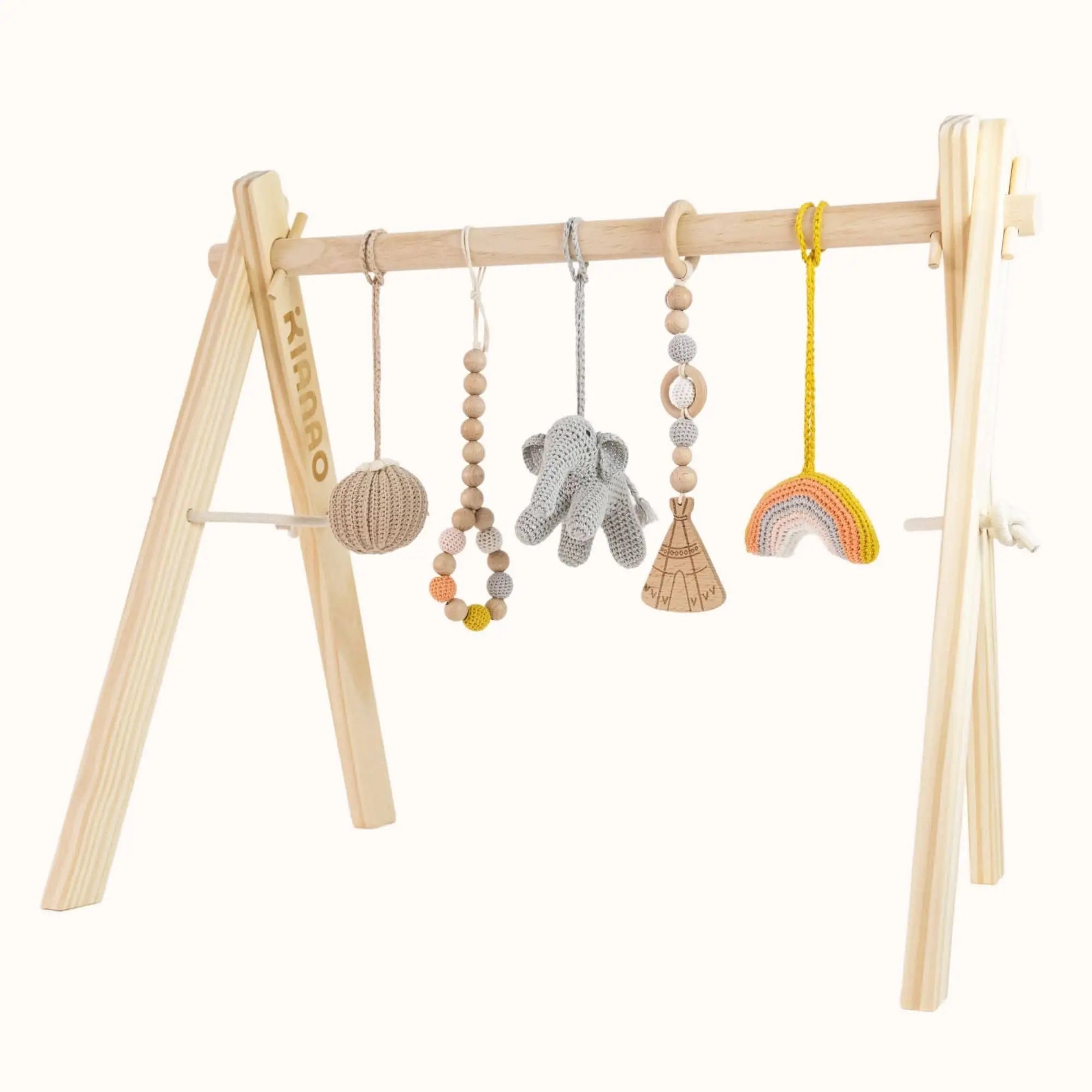 Natural wooden baby gym with colorful hanging toys including grey elephant, wooden ring, and orange geometric shape