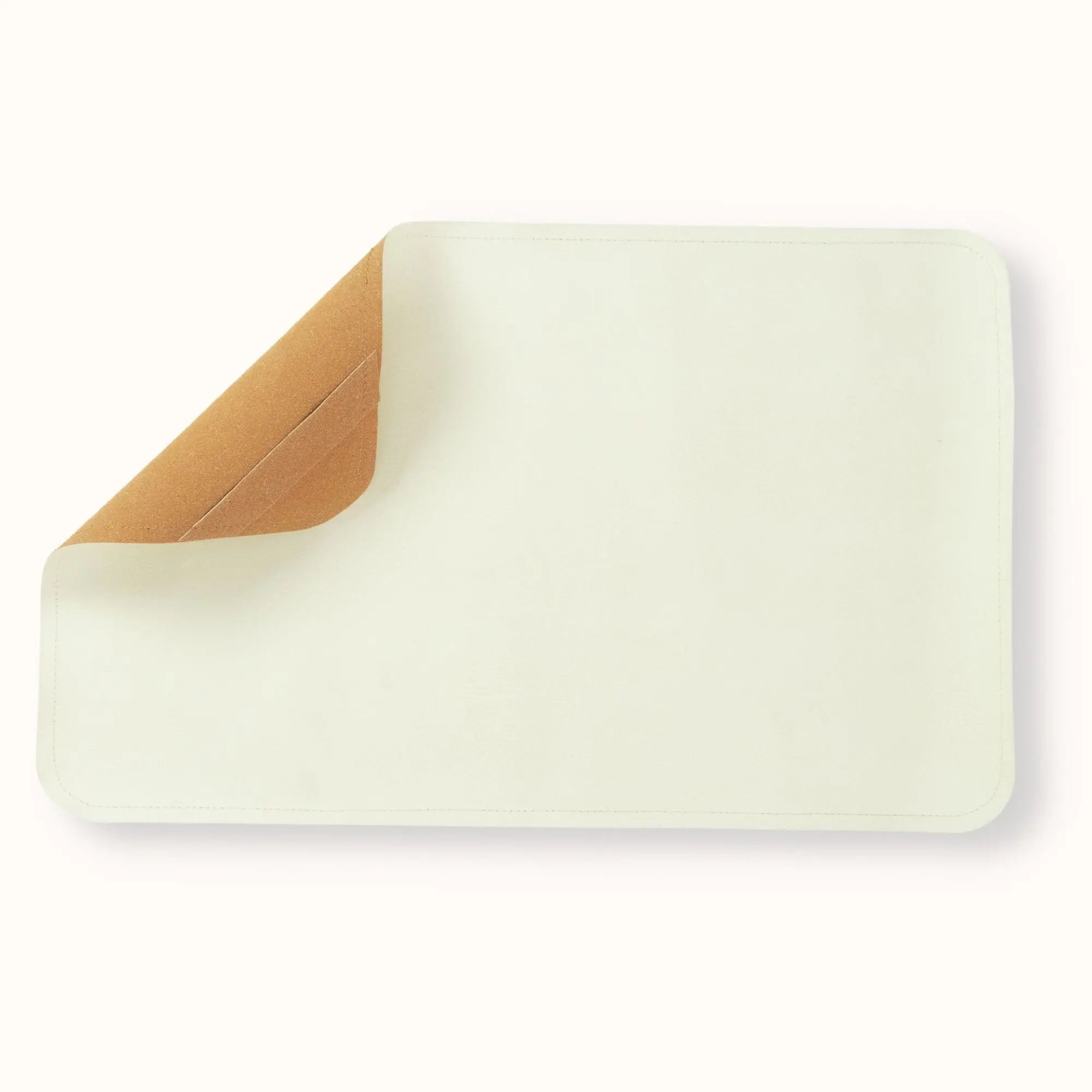 oat cream waterproof baby changing mat with premium vegan leather surface and tan corner detail