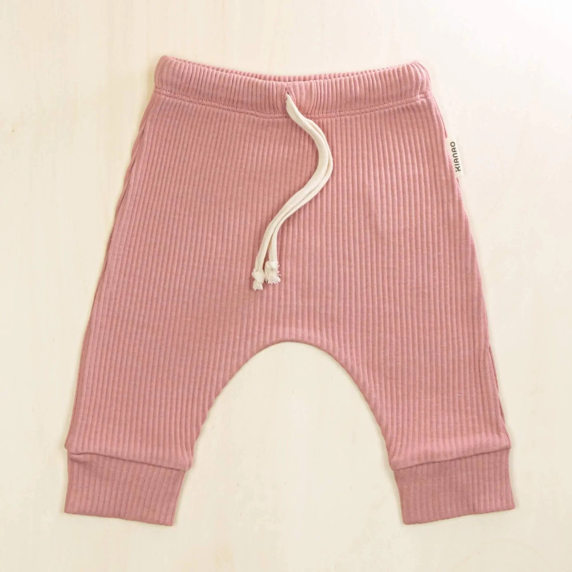 old rose baby pants made from premium organic cotton, featuring drawstring waist and cuffed ankles for growing babies