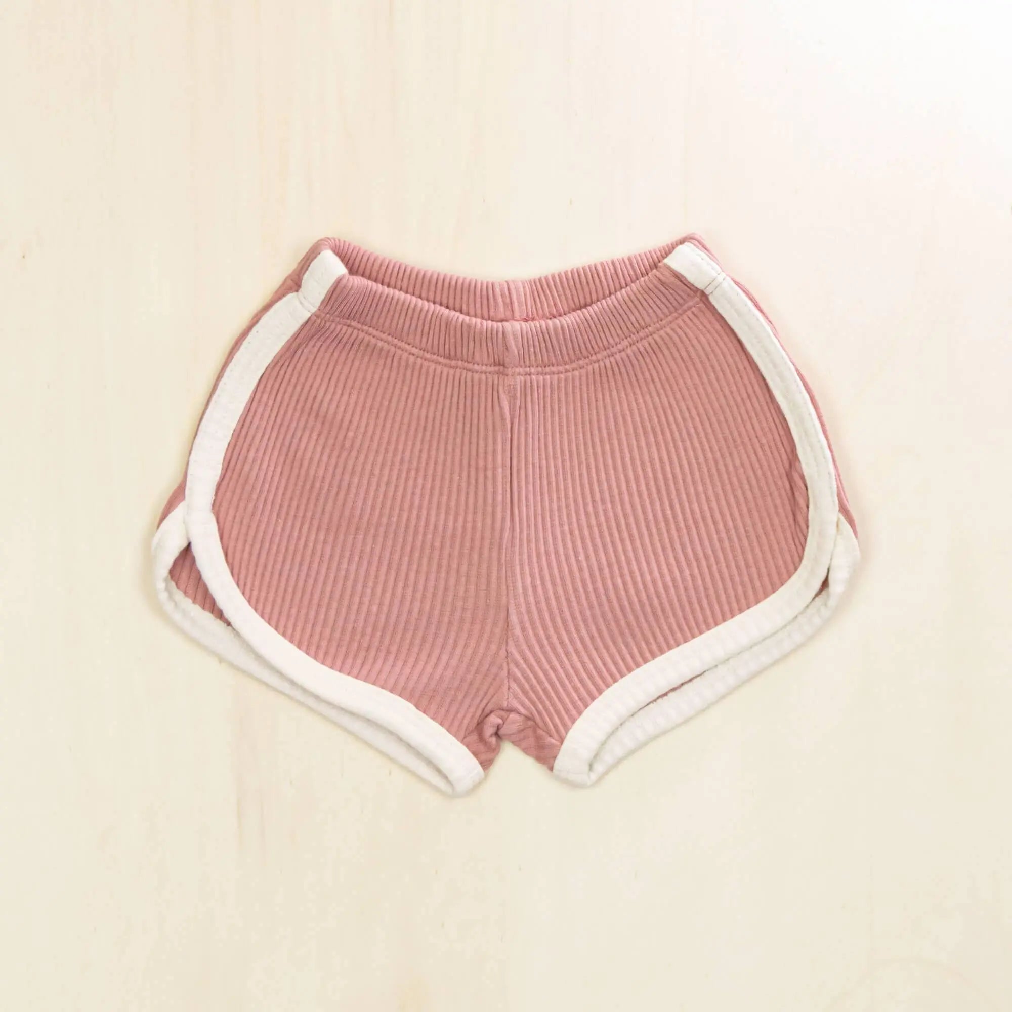 blossom white organic cotton baby shorts with contrasting trim, soft ribbed texture gentle on sensitive skin