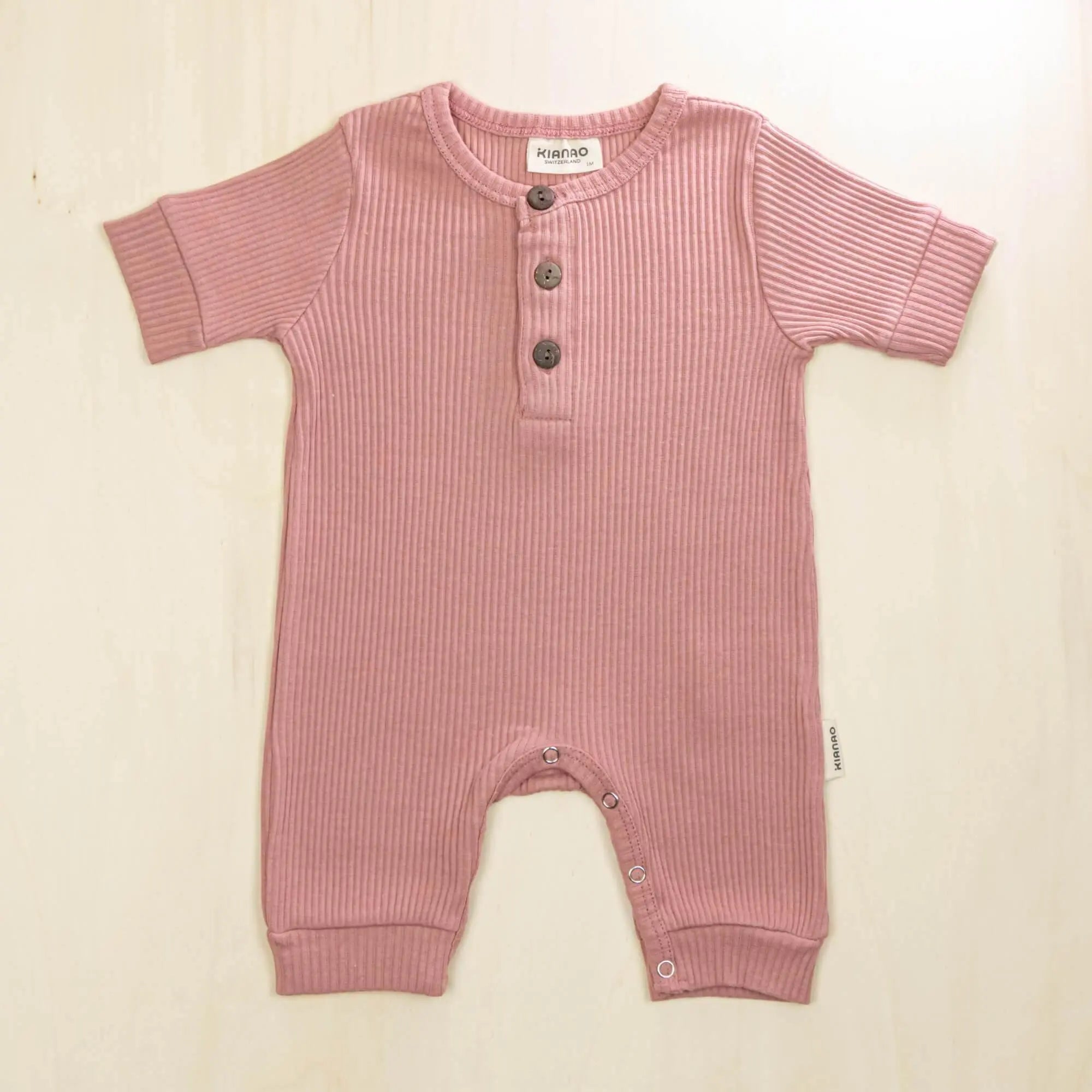 old rose organic cotton button-front baby romper made with 95% organic cotton for sensitive skin