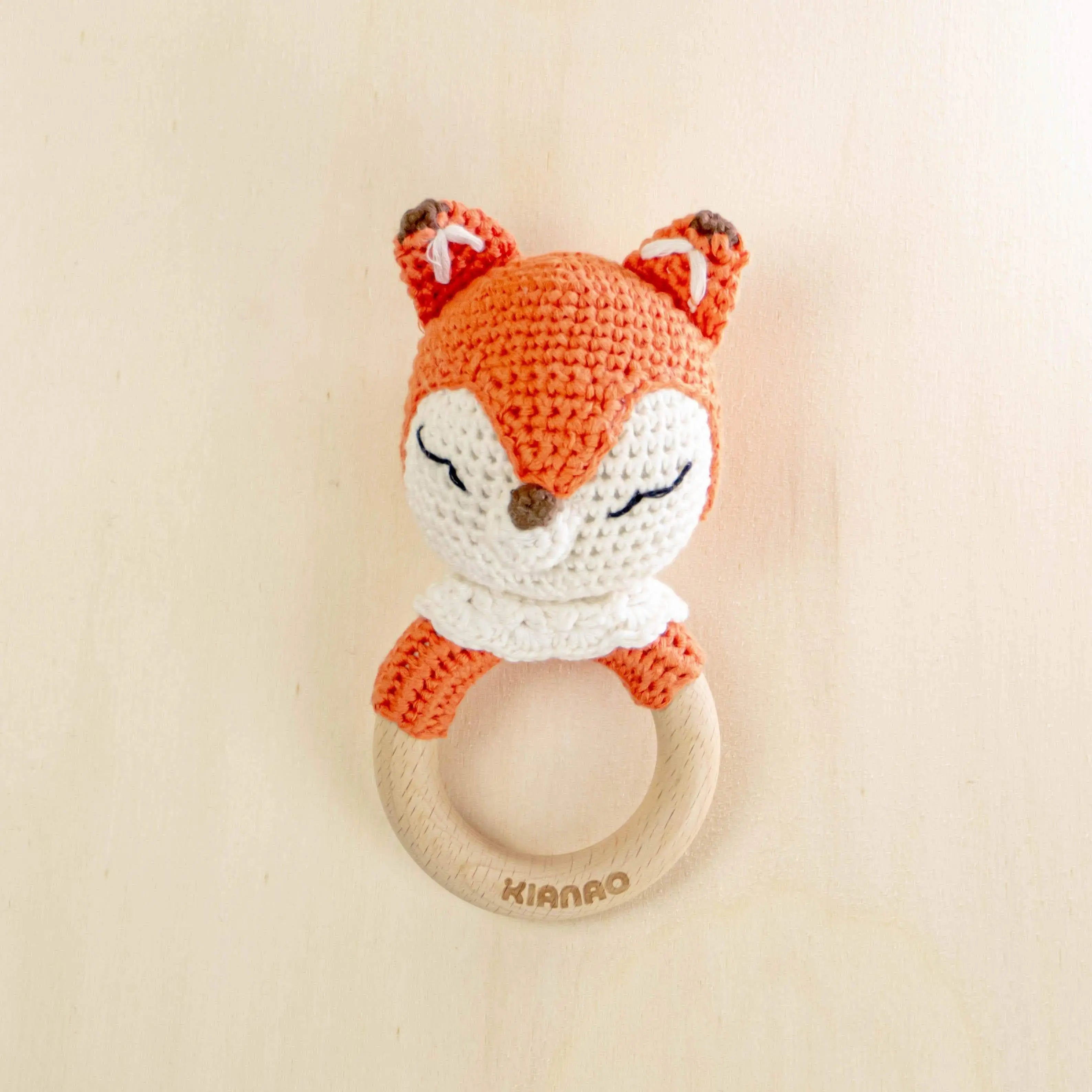 orange crochet fox rattle tooth ring with natural wooden teether for sensory development and teething relief