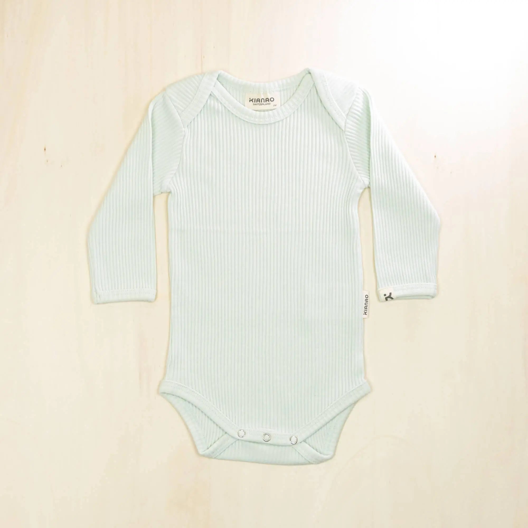 pale turquoise long sleeve organic cotton baby bodysuit made from 95% organic cotton for sensitive skin