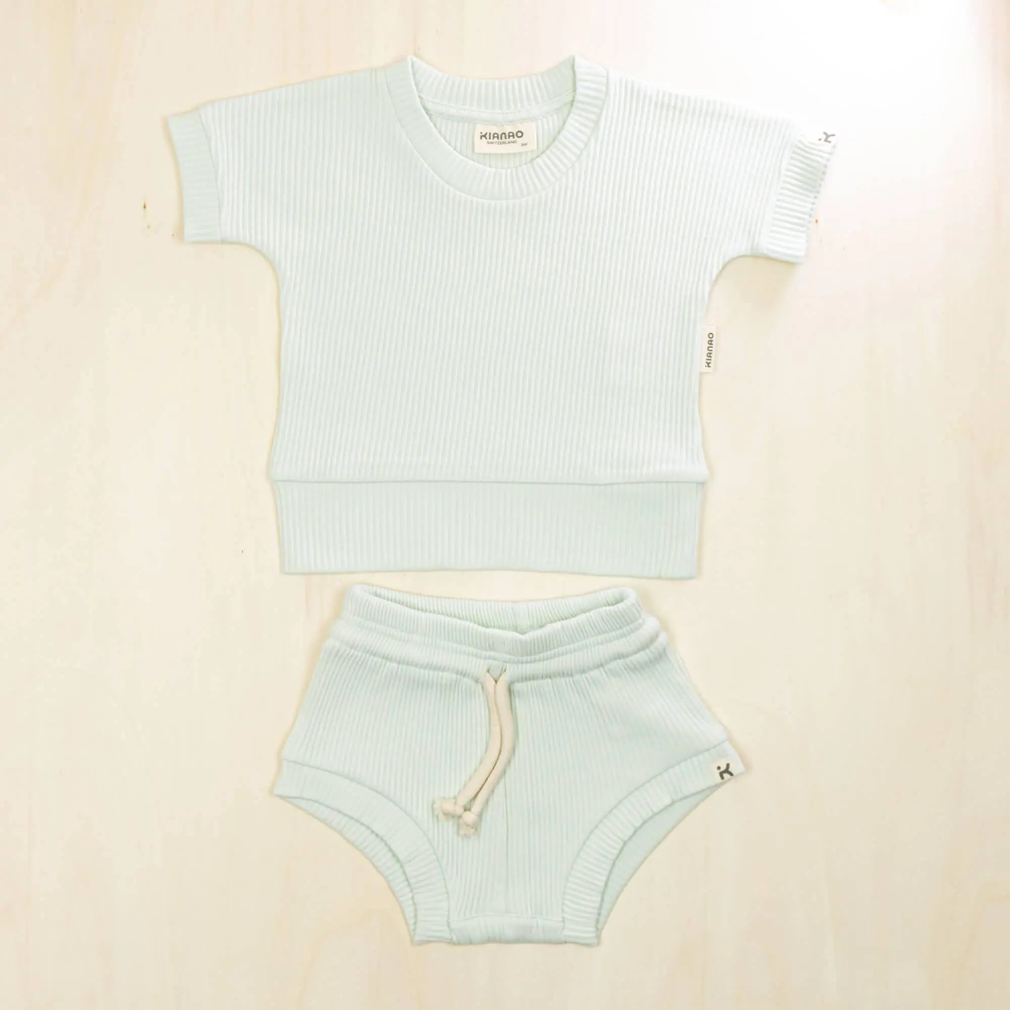pale turquoise organic cotton two-piece baby outfit with gentle fabric that won't irritate sensitive skin