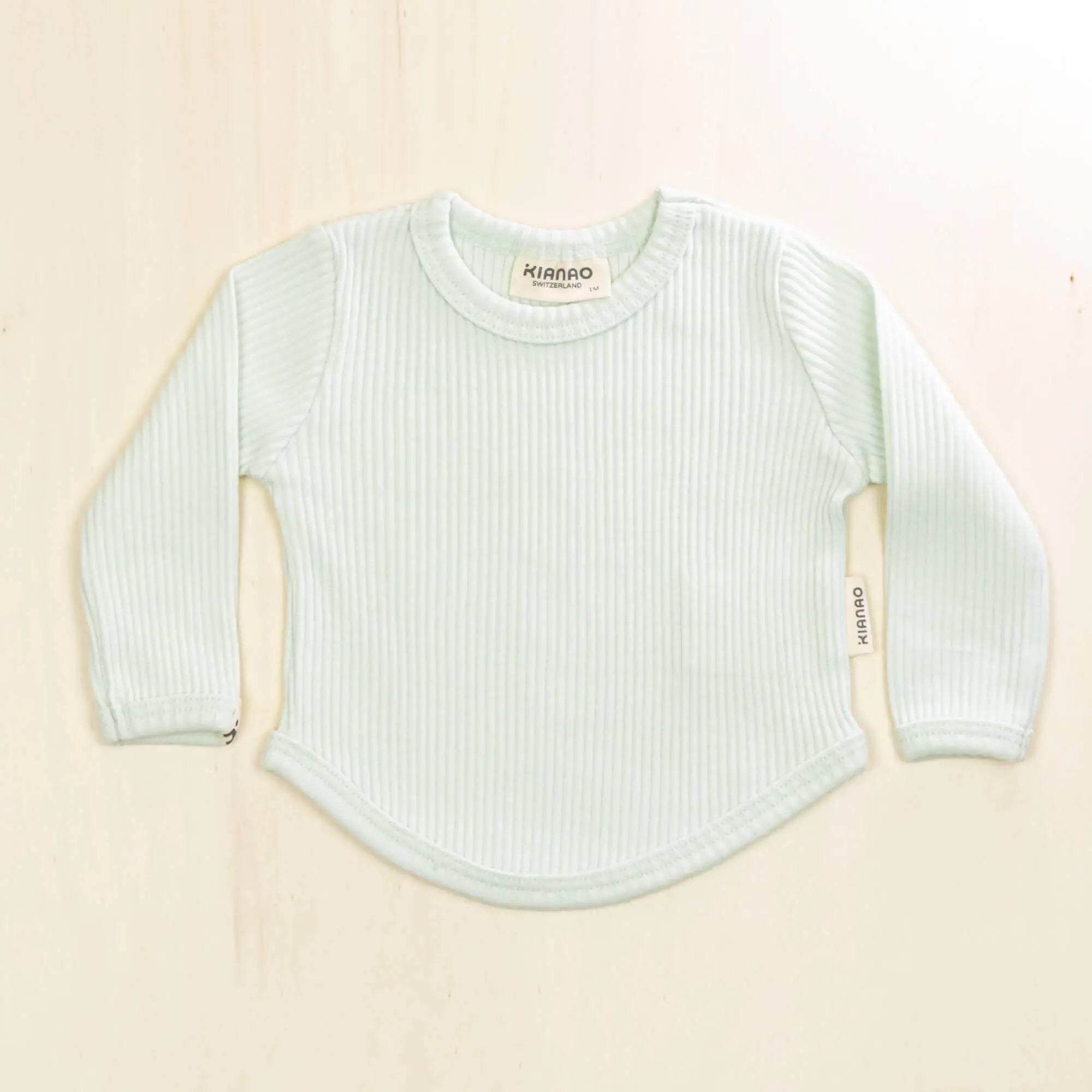 pale turquoise organic cotton baby shirt with ribbed texture and long sleeves, breathable fabric for all-day comfort