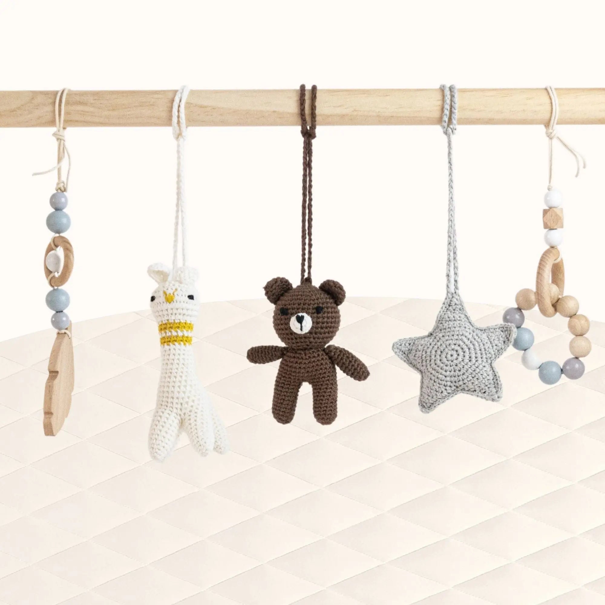 Front view of Panda Play Gym with all toys visible showcasing the monochrome grey and natural wood palette