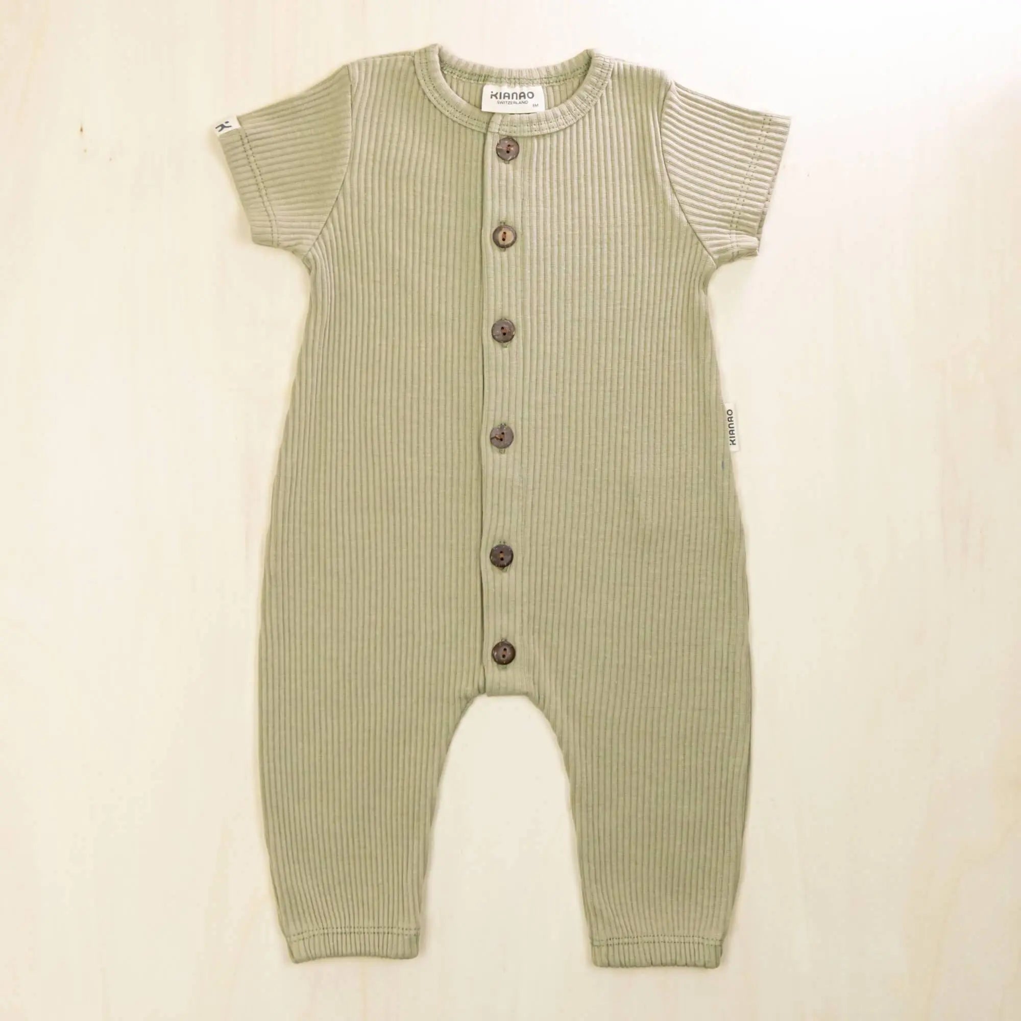 sage green baby jumpsuit in eco-friendly organic cotton, harem style baby clothes with room to grow