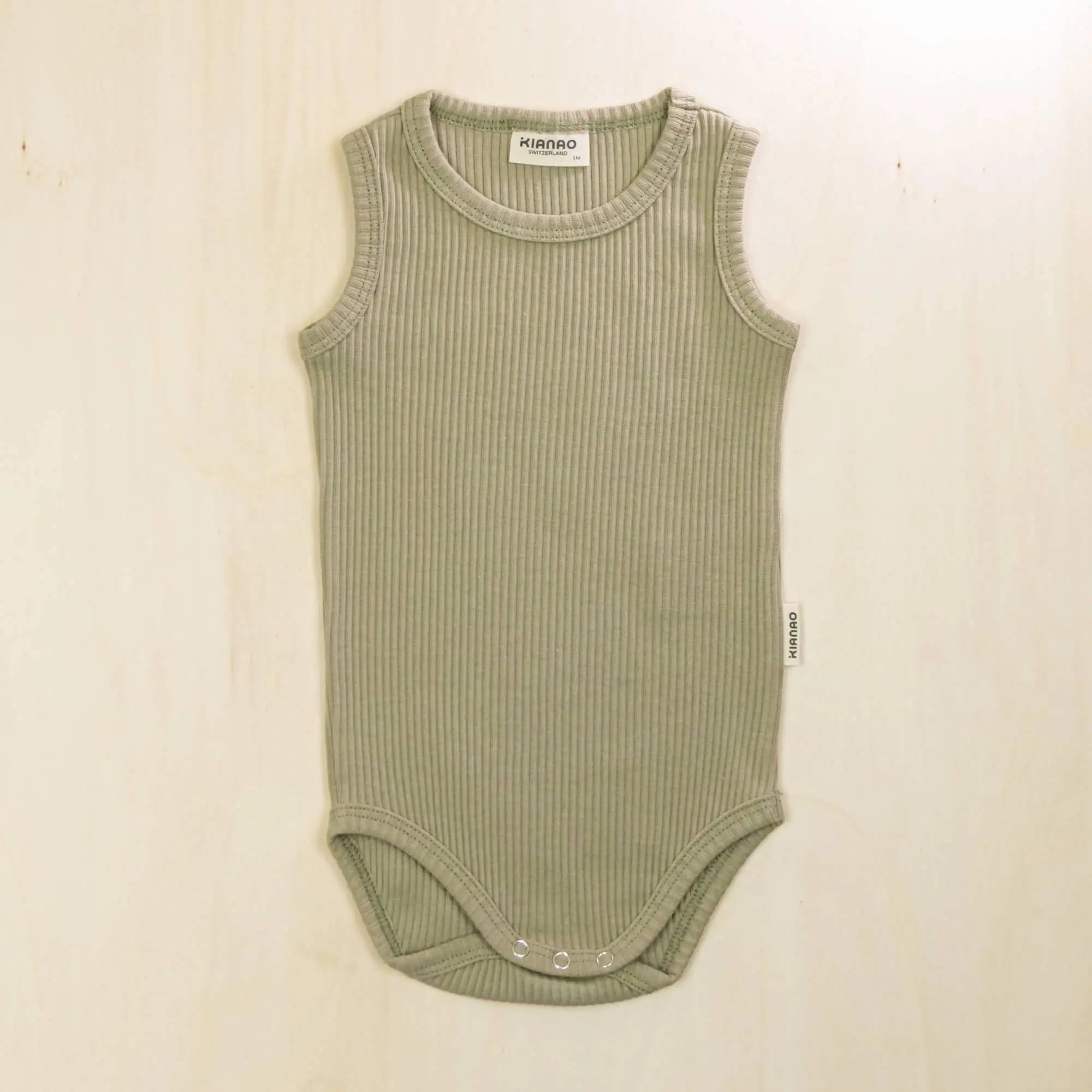 sage green organic cotton baby bodysuit perfect for layering or warm weather wear