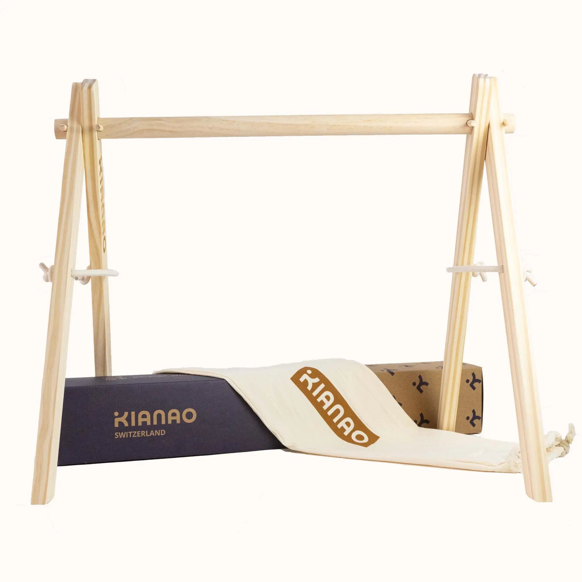 Wooden Unicorn Play Gym frame shown with black play mat option for modern nursery aesthetic
