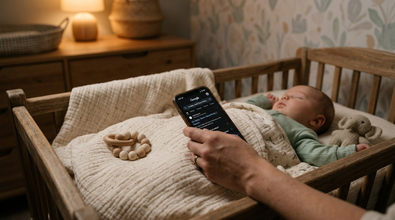 Close up of an 11-month-old baby smiling and showing newly erupted baby teeth