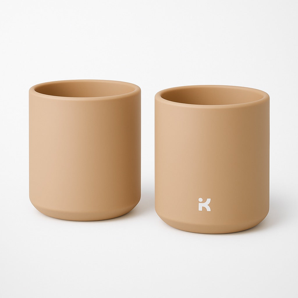 Sand Color silicone mug featuring the weighted bottom design that helps prevent tipping and spills
