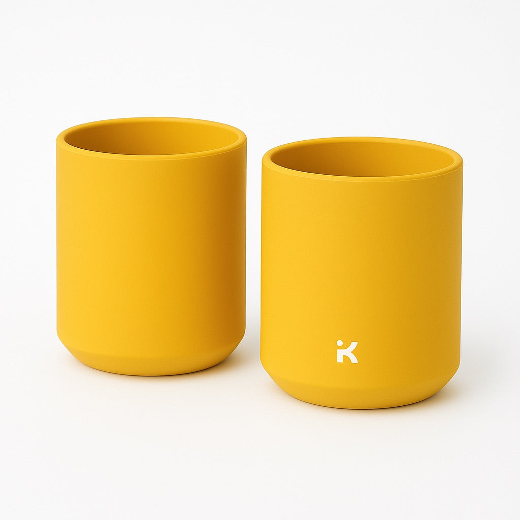 Sand Yellow silicone mug stacked, showing the space-saving storage capability and design