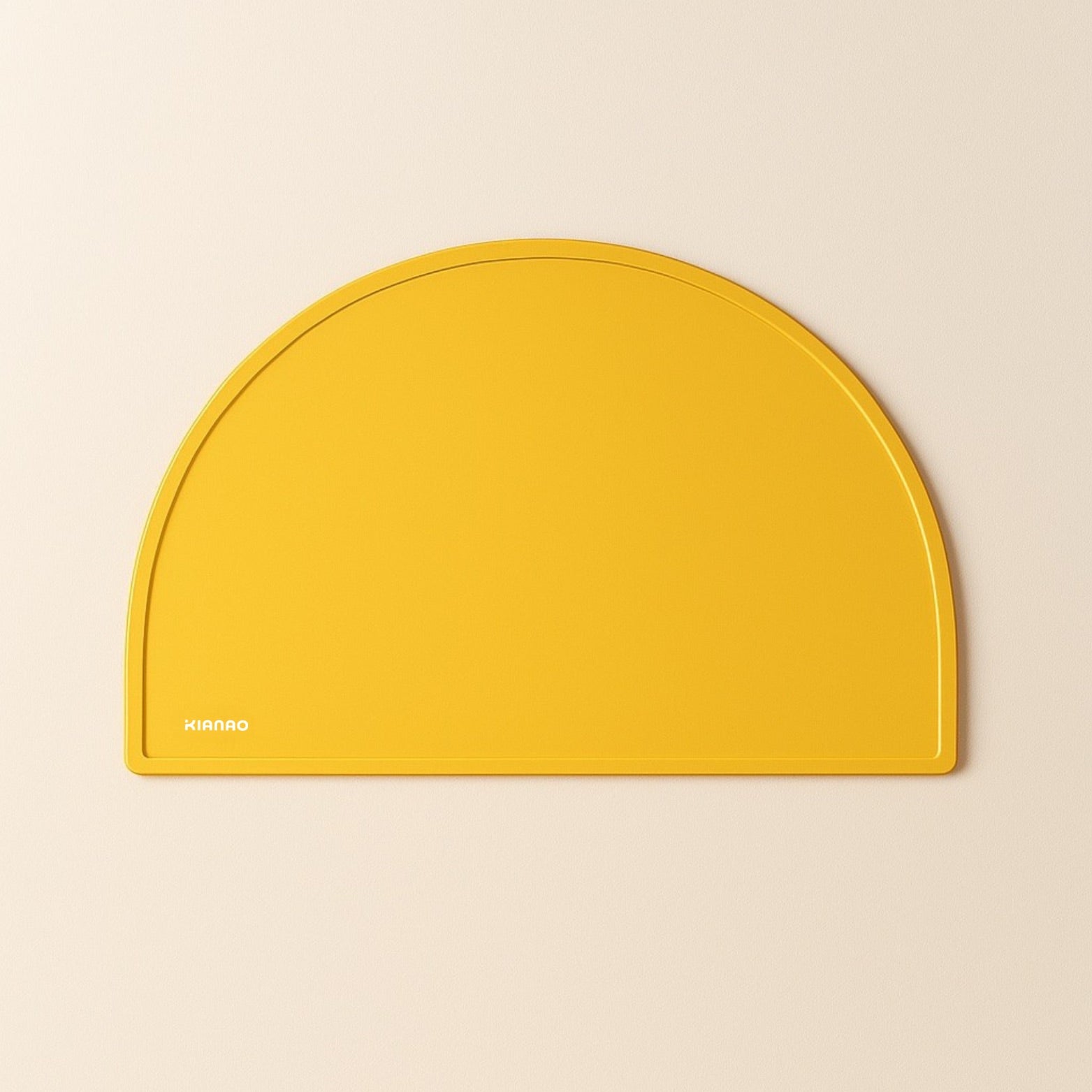 Sand Yellow silicone placemat with modern half-moon design and practical raised edge to contain spills