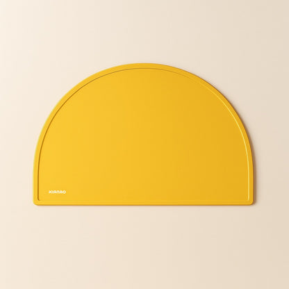 Sand Yellow silicone placemat with modern half-moon design and practical raised edge to contain spills