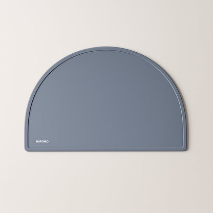 Slate Gray silicone placemat featuring minimalist half-circle shape and spill-containing raised edges