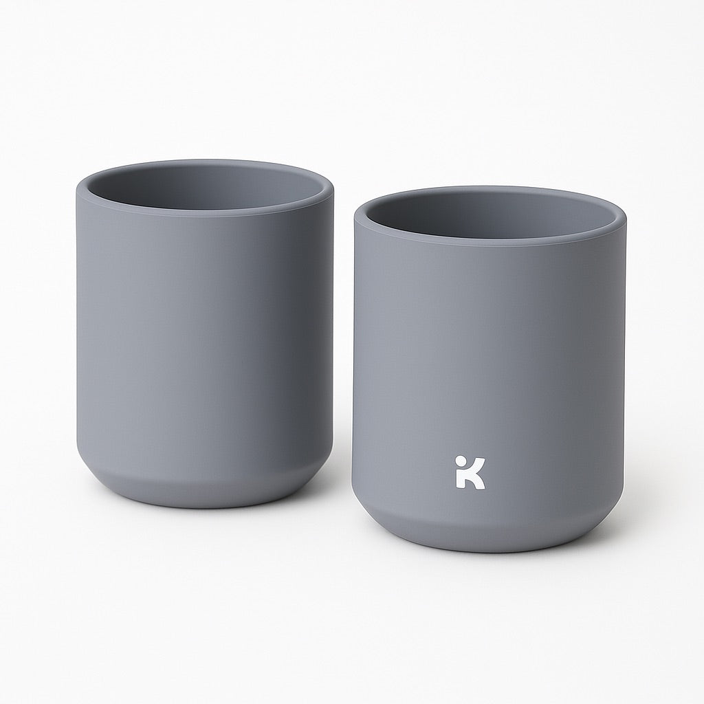 Slate Gray silicone mug shown in use, demonstrating the easy gripping and drinking design