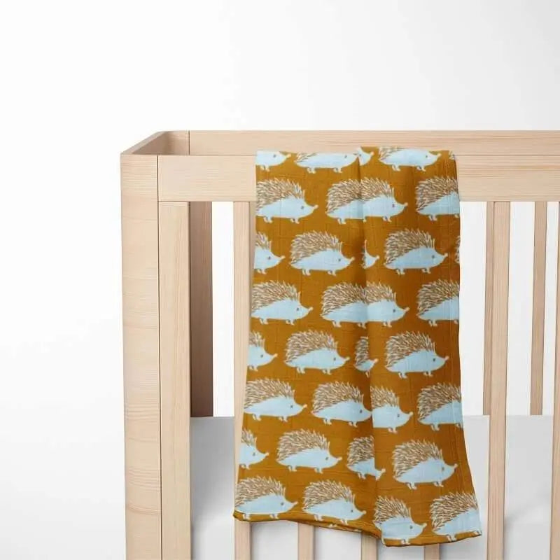 Mustard yellow organic cotton baby blanket with light blue hedgehog pattern - chemical-free fabric gentle for sensitive newborn skin