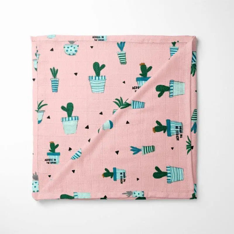 Pink organic cotton baby blanket with blue and green cactus pattern - GOTS certified chemical-free fabric for sensitive skin