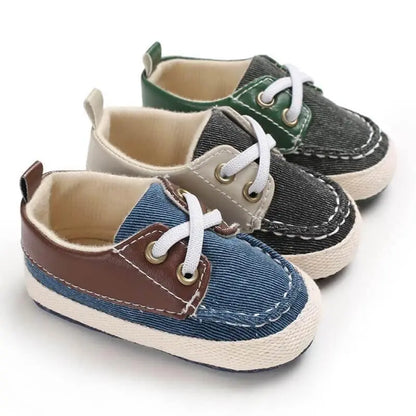 set of baby sneakers in green, brown and gray with soft soles and classic boat shoe design