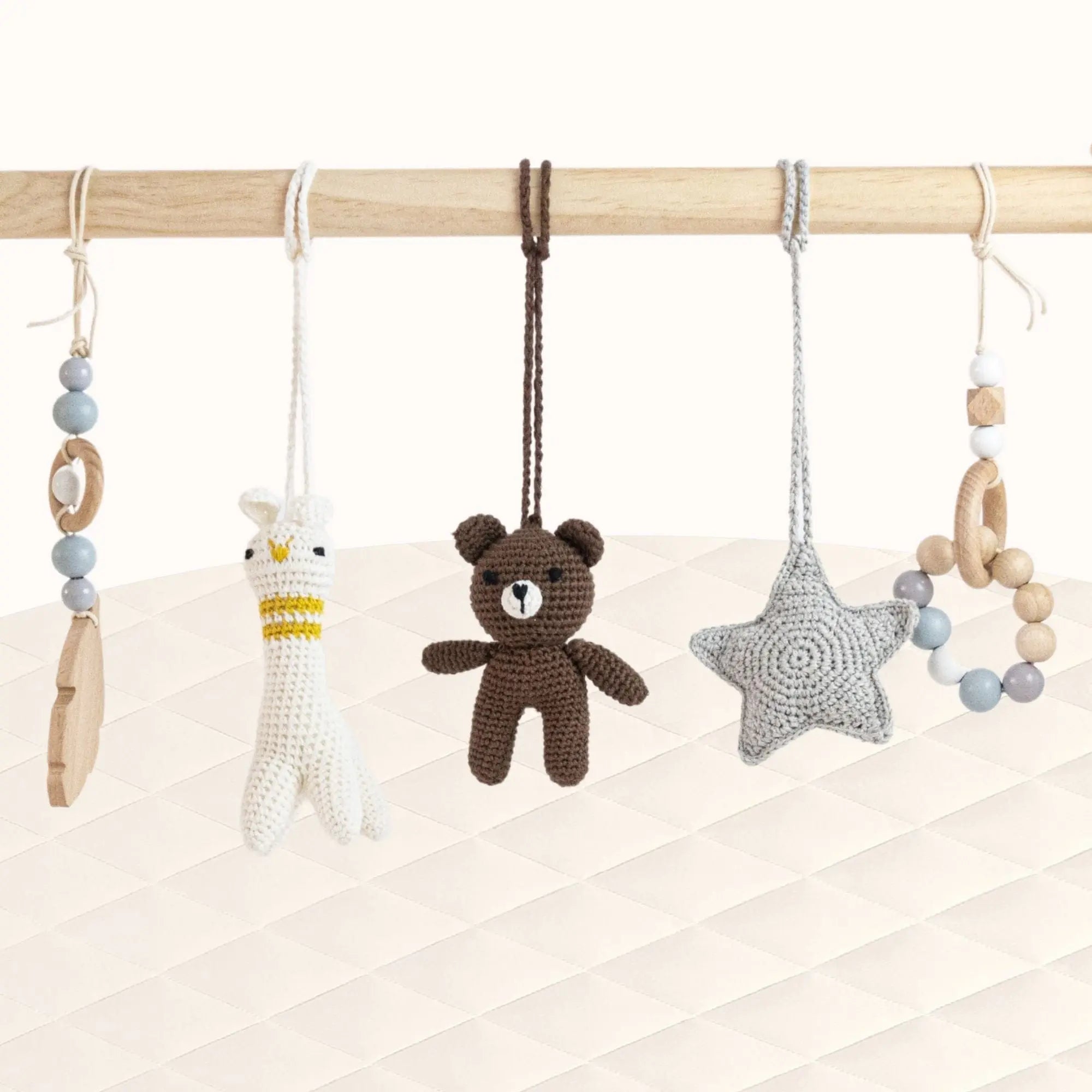 Front view of Bear and Lama Play Gym with all toys visible showing charming character theme