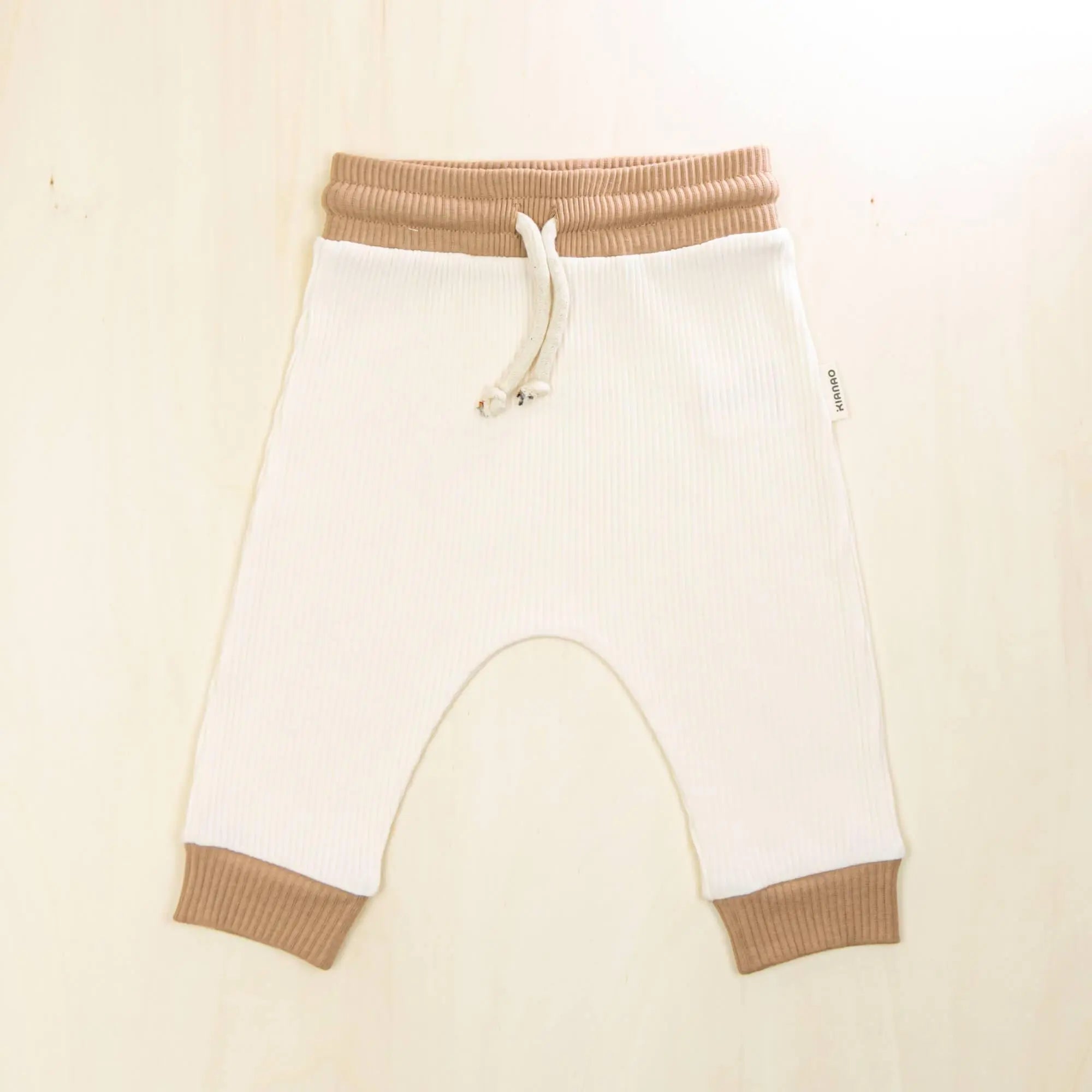 blossom white organic cotton baby pants with contrast trim, soft retro jogger design gentle on sensitive skin