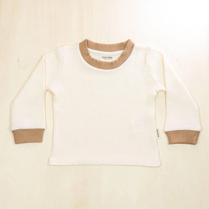 blossom white organic cotton baby sweater with matching white trim, classic retro style with gentle elasticized neckline