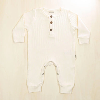 blossom white organic cotton baby jumpsuit with button detail perfect for sensitive skin