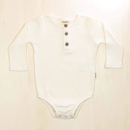blossom white organic cotton baby bodysuit featuring button front design and cozy long sleeves for layering