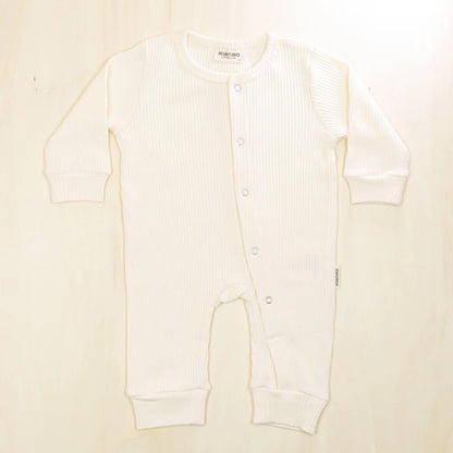 blossom white organic cotton baby romper with gentle elastic cuffs that won't irritate delicate skin