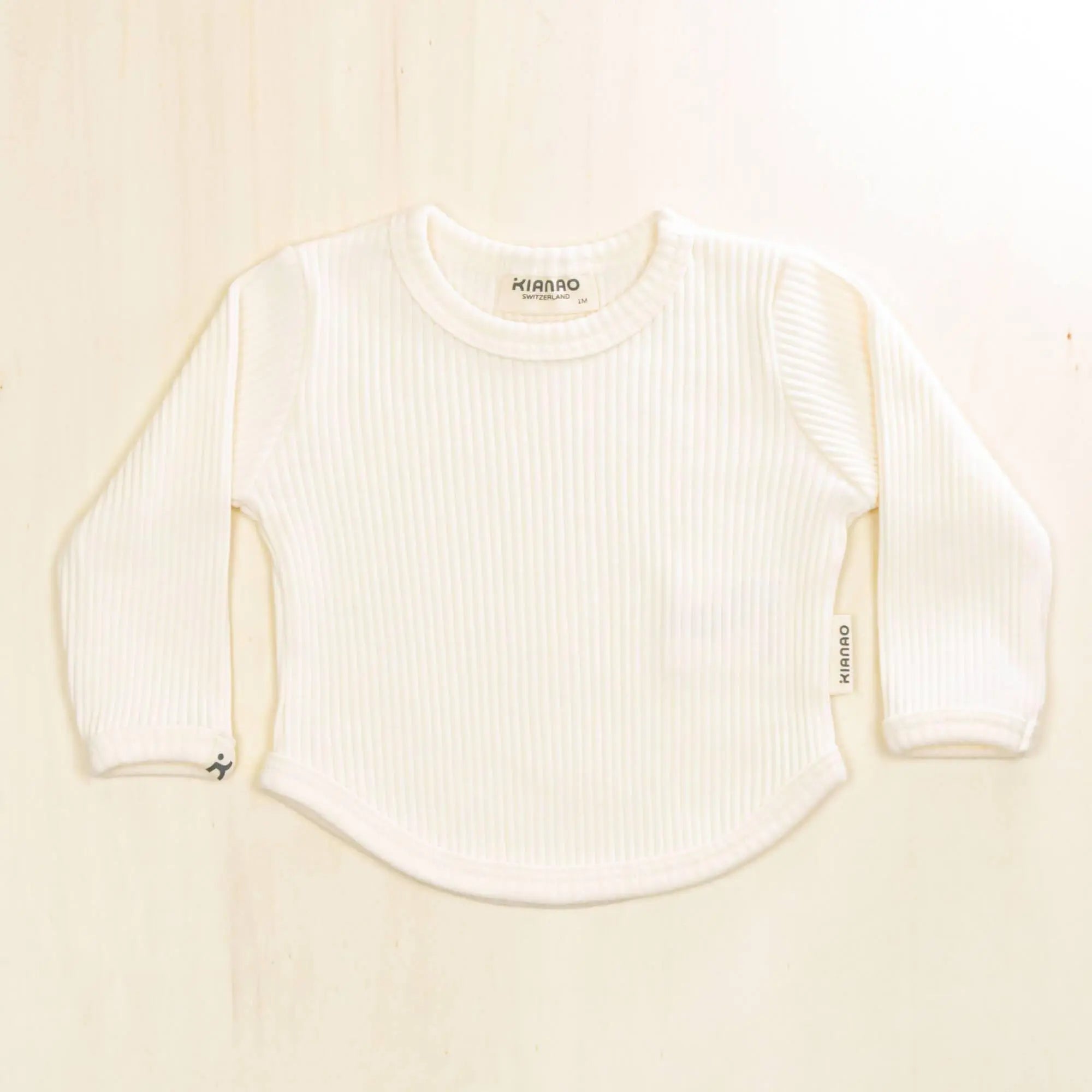 blossom white organic cotton baby shirt with ribbed texture and long sleeves, pure organic material that's gentle on skin