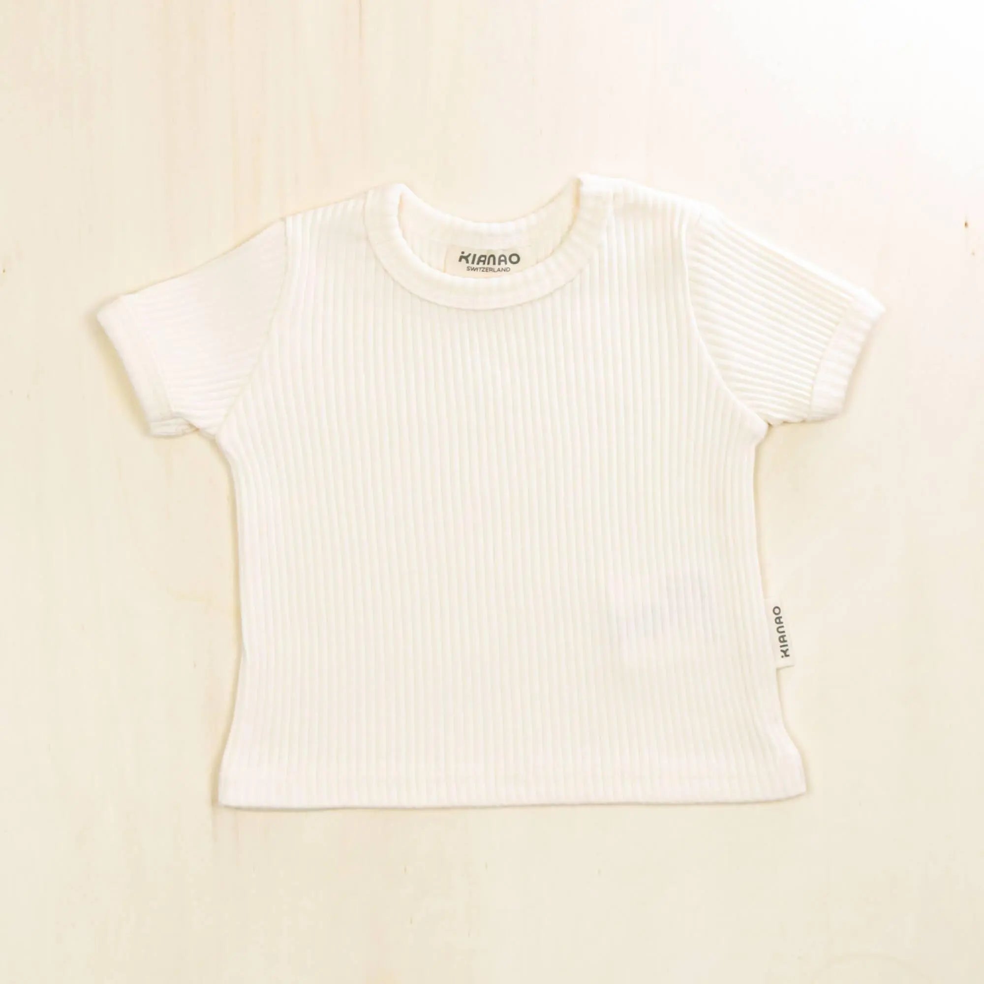 blossom white organic cotton baby t-shirt with ribbed texture and short sleeves, pure organic material that's gentle on skin