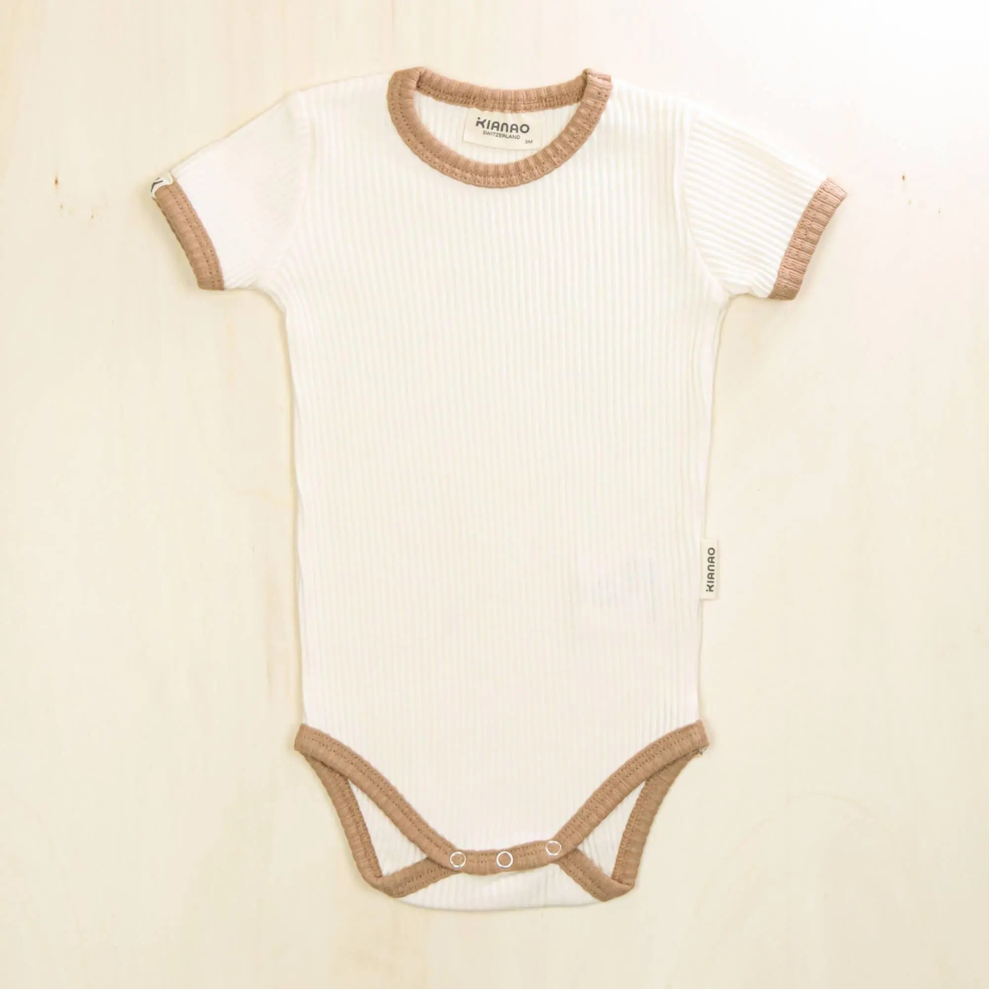 blossom white short sleeve organic cotton baby bodysuit with contrast trim perfect for sensitive skin