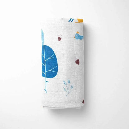 closeup of folded bamboo baby blanket showing detail of blue fox and leaf design on premium organic bamboo fabric